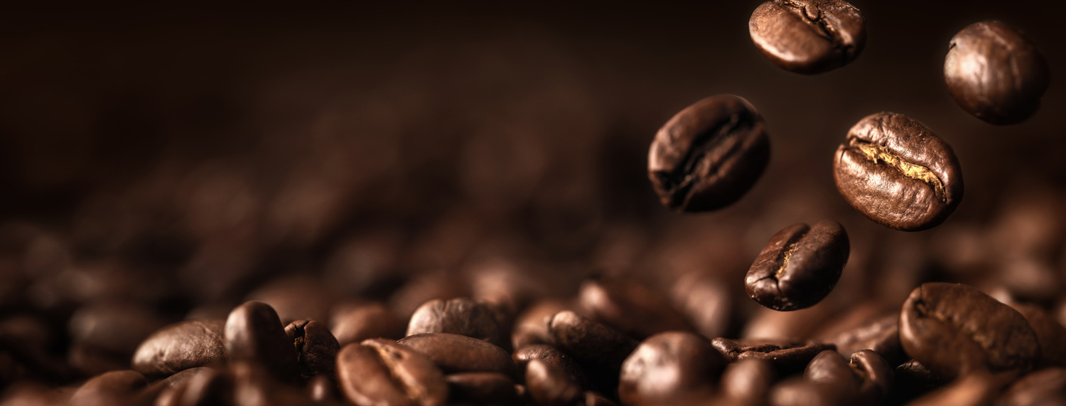 Brown Roasted Coffee Beans Closeup On Dark Background